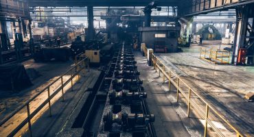 Steel pipe conveyor in the building of Iron and Steel Factory or Pipe Mill located in Taganrog South of Russia